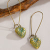 Wholesale Alloy Geometric Oval Spiral Hollow Pendant Earrings For Women Electroplated Retro Bohemian Style