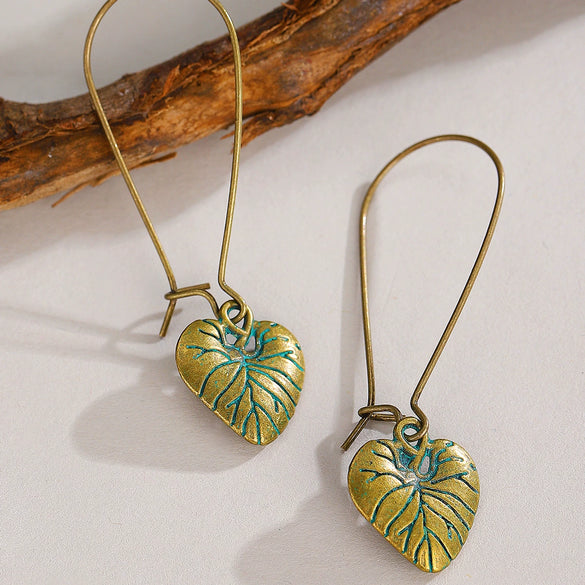 Wholesale Alloy Geometric Oval Spiral Hollow Pendant Earrings For Women Electroplated Retro Bohemian Style