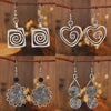 Wholesale Alloy Geometric Oval Spiral Hollow Pendant Earrings For Women Electroplated Retro Bohemian Style
