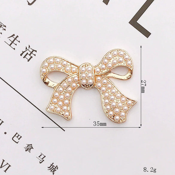 Wholesale Alloy Mobile Phone Shell Jewelry Accessories With Pearl Bow And Electroplating Treatment