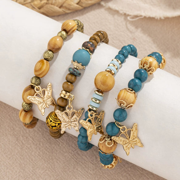 Wholesale Alloy Multilayer Wooden Beaded Bohemian Style Bracelet With Butterfly Pendant And Electroplating Treatment