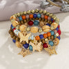 Wholesale Alloy Multilayer Wooden Beaded Bohemian Style Bracelet With Butterfly Pendant And Electroplating Treatment