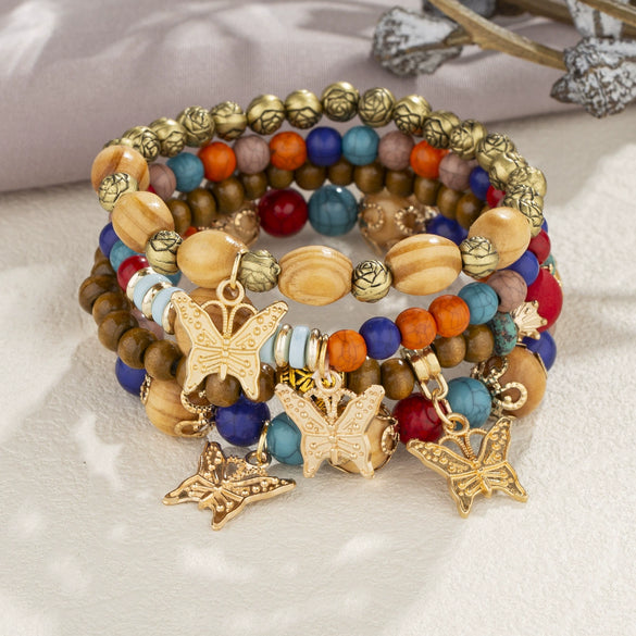 Wholesale Alloy Multilayer Wooden Beaded Bohemian Style Bracelet With Butterfly Pendant And Electroplating Treatment