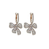 Wholesale Alloy Pearl Inlaid Bow Earrings For Women Silver Needle Light Luxury Personality Style