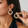 Wholesale Alloy Pleated Geometric Cut Out Spiral Flower Design Electroplated Women's Earrings