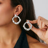 Wholesale Alloy Pleated Geometric Cut Out Spiral Flower Design Electroplated Women's Earrings