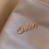 Wholesale Alloy Women's Natural Style Letter Brooch With Electroplating
