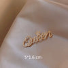 Wholesale Alloy Women's Natural Style Letter Brooch With Electroplating