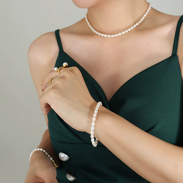 Wholesale Baroque Style Titanium Steel Freshwater Pearl Necklace And Bracelet Jewelry Set With Otto Buckle And Electroplating