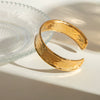 Wholesale Classic Stainless Steel Widefaced Hammer Pattern Open Bracelet Jewelry With 18K Gold Electroplating Does Not Fade