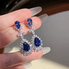 Wholesale Copper Dropshaped Flower Pattern Artificial Earrings For Women Business Style