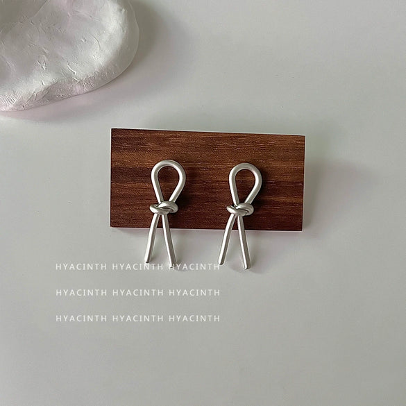 Wholesale Copper Geometric Bow Knot Twisted Matte Electroplated Earrings For Women