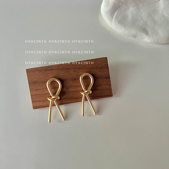 Wholesale Copper Geometric Bow Knot Twisted Matte Electroplated Earrings For Women