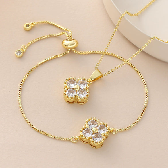 Wholesale Copper Goldplated Fourleaf Clover Pendant Necklace And Bracelet Set Jewelry For Women With Plants And Flowers Pattern And O Word Chain