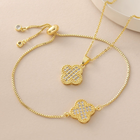Wholesale Copper Goldplated Fourleaf Clover Pendant Necklace And Bracelet Set Jewelry For Women With Plants And Flowers Pattern And O Word Chain