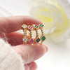 Wholesale Copper Inlaid Colored Diamond Geometric Flower Petal Fourleaf Clover Open Adjustable Women's Ring With Electroplating