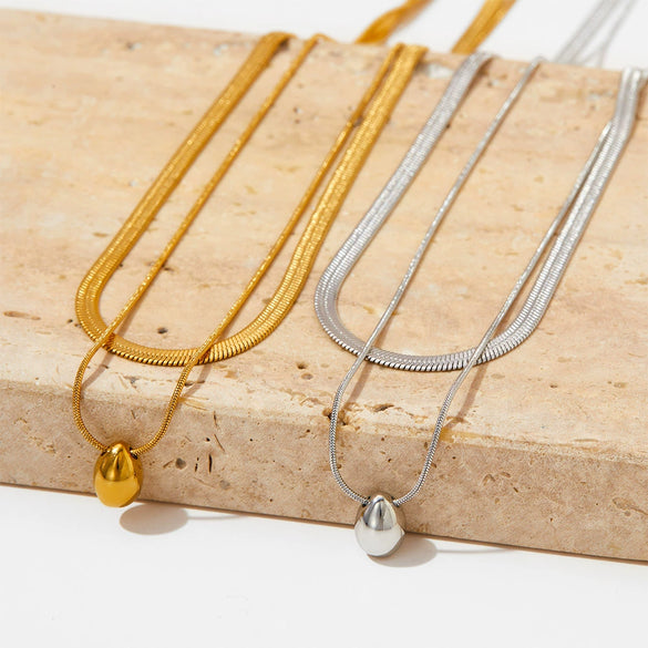Wholesale Doublelayer Dropshaped Titanium Steel And Stainless Steel Pendant Necklace With Snake Bone Chain In Simple Style And Electroplating Treatment