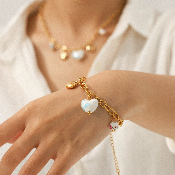 Wholesale Electroplated Stainless Steel And Ceramic Jewelry For Women With Heartshaped And Geometric Patterns Including Pendant Necklaces Bracelets And Earrings