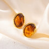 Wholesale Elegant Amber Titanium Steel Geometric Earrings Plated With 18K Gold