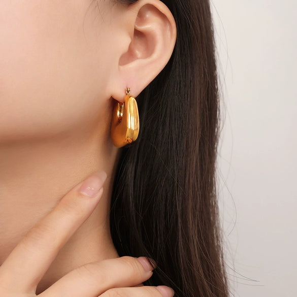 Wholesale Elegant Golden Hollow Small Lucky Bag Earrings In Titanium Steel With Geometric U Shaped Pattern And Electroplating Treatment For Women