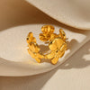 Wholesale Exaggerated Geometric Hollow Flower Stainless Steel 18K Goldplated Asymmetric Ring For Women With Leaves And Wave Pattern