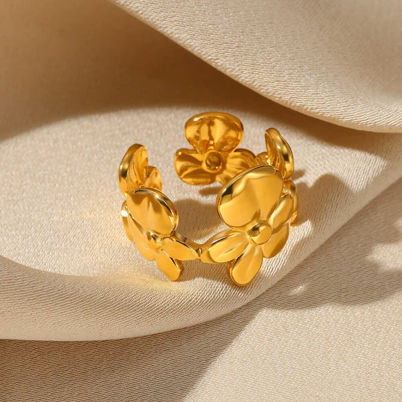 Wholesale Exaggerated Geometric Hollow Flower Stainless Steel 18K Goldplated Asymmetric Ring For Women With Leaves And Wave Pattern