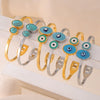 Wholesale Fashion Blue Eye Pattern Round Titanium Steel Goldplated Spring Bracelet Jewelry