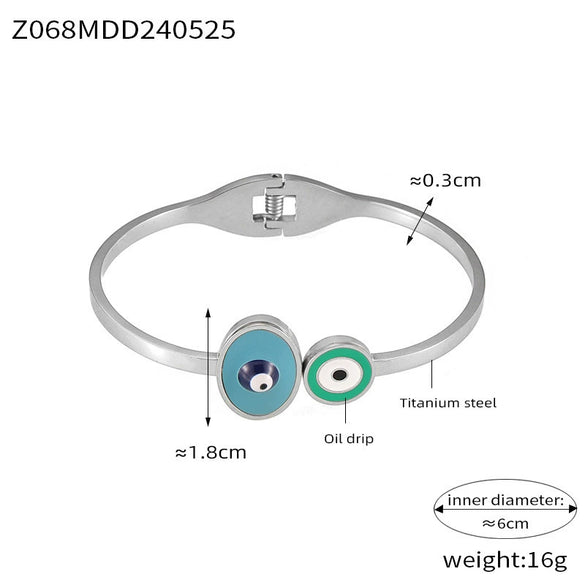 Wholesale Fashion Blue Eye Pattern Round Titanium Steel Goldplated Spring Bracelet Jewelry