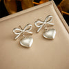 Wholesale Fashion Niche Design Goldplated Stainless Steel Heart Bow Love Pendant Hanging Earrings For Women