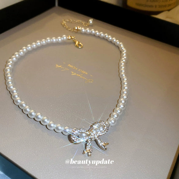 Wholesale French Retro Pearl And Mixed Gem Inlay Bow Necklace For Women