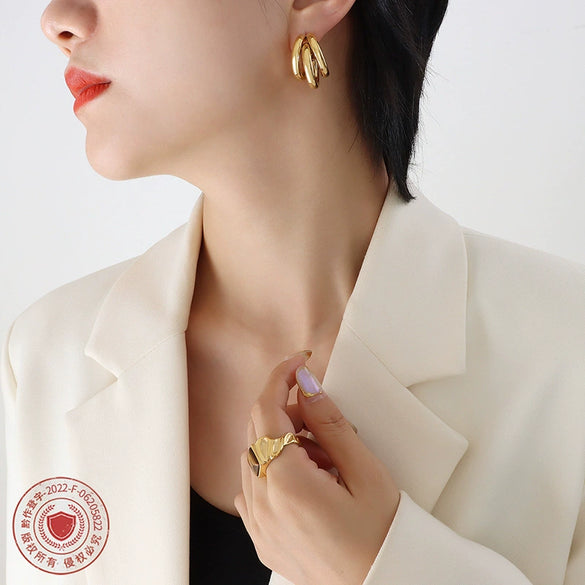 Wholesale Geometric Cshaped Hollow Round Tube Goldplated Titanium Steel Earrings With Niche Design