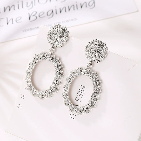 Wholesale Geometric Exaggerated Circle Relief Frosted Alloy Earrings For Ladies With Electroplating Treatment