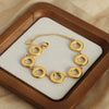 Wholesale Geometric Glossy Ring Stitching Design Titanium Steel Goldplated Unisex Jewelry Suit With Earrings