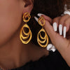 Wholesale Geometric Irregular Loop Winding Titanium Steel Goldplated Nonfading Earrings For Women With Electroplating Design