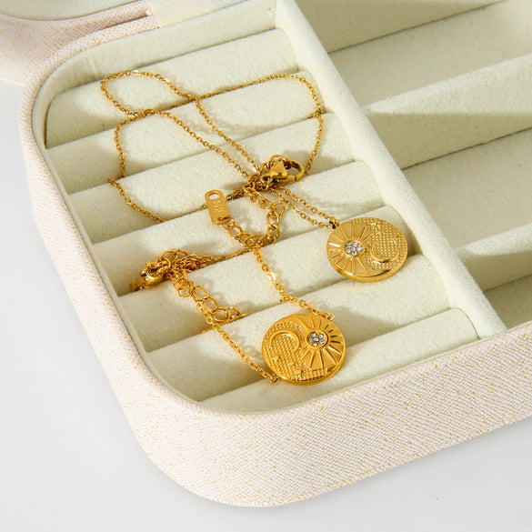 Wholesale Geometric Titanium Steel And Stainless Steel Electroplated Sun And Moon Embossed Round Pendant Necklace And Bracelet For Women