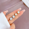 Wholesale Geometric Titanium Steel Fiveleaf Flower Normcore Style Electroplated Earrings For Men And Women