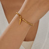 Wholesale Gold Plated Stainless Steel Drop Shape Bracelet With Rivet Pendant And Thick Bar Design For Women