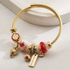 Wholesale Golden Stainless Steel Alloy Women's Bracelet With Diamond Treatment And Small Animal Pendant