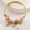 Wholesale Golden Stainless Steel Alloy Women's Bracelet With Diamond Treatment And Small Animal Pendant
