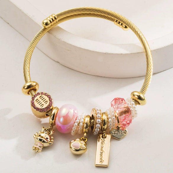 Wholesale Golden Stainless Steel Alloy Women's Bracelet With Diamond Treatment And Small Animal Pendant