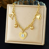 Wholesale Goldplated Stainless Steel Heart Shape Hollow Pendant With O Word Chain Necklace For Women