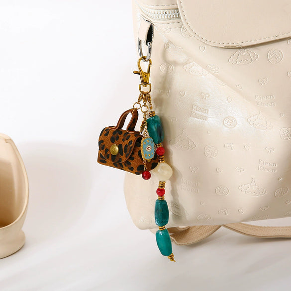 Wholesale Goldplated Stainless Steel Heart Water Drop Bell Pattern Earphone Case Bag Pendant Keychain For Women