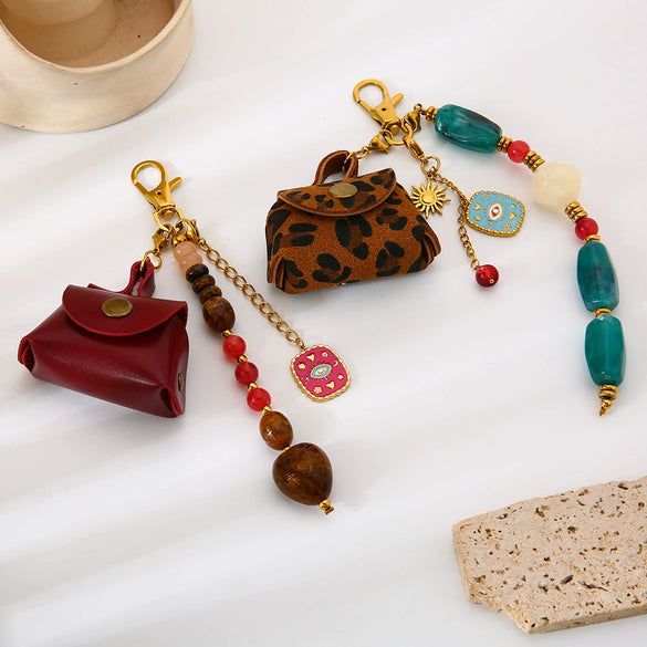 Wholesale Goldplated Stainless Steel Heart Water Drop Bell Pattern Earphone Case Bag Pendant Keychain For Women