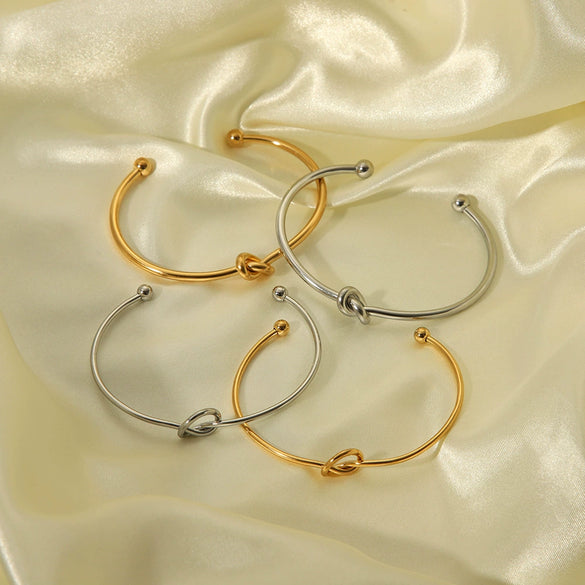 Wholesale High End Niche Design Glossy Knotted Stainless Steel Bracelet With 18K Gold Plated Color Preserving Vacuum Real Gold Electroplating In Pvd Furnace