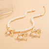Wholesale Imitation Pearl And Alloy Ball Bead Chain Bow Collarbone Necklace With Electroplating Treatment Light Luxury Style