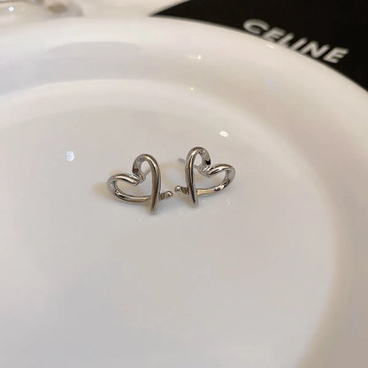 Wholesale Jewelry 1 Pair Simple Style Heart Shape Solid Color Twist Metal Zircon Earrings Ear Studs