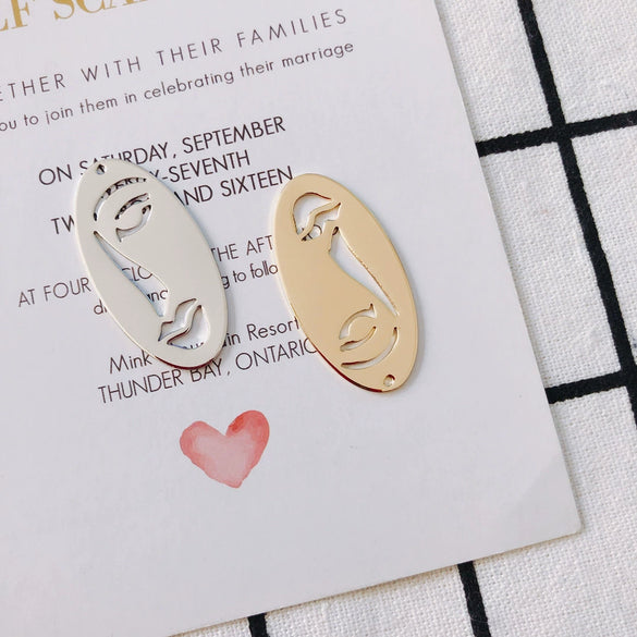 Wholesale Jewelry Accessories Alloy Electroplated Abstract Face Pendant Earrings