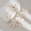 Wholesale Jewelry Exaggerated Iron Imitation Pearls Dripping Oil Fivepetal Flower Threedimensional Starfish Ring Electroplated