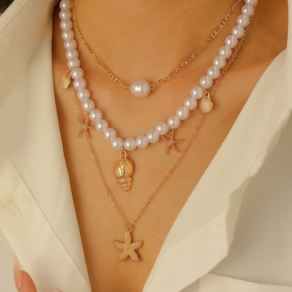 Wholesale Jewelry Retro Ocean Holiday Imitation Pearl Starfish Shell Necklace For Women With Star Pattern And Set With Diamonds In Mixed Materials And Alloy Pendant