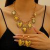 Wholesale Jewelry Retro Personality Sacred Heart Alloy Pendant Necklace And Earrings With Electroplating